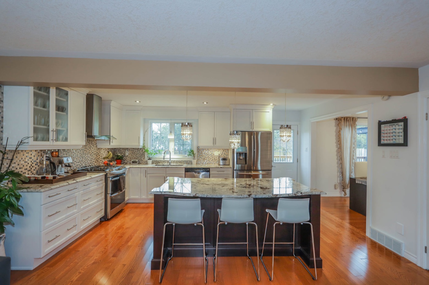 Kitchen cabinets painted in a bright white